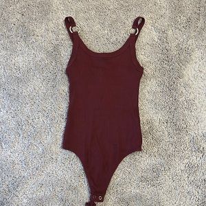 Maroon body suit with silver detailing